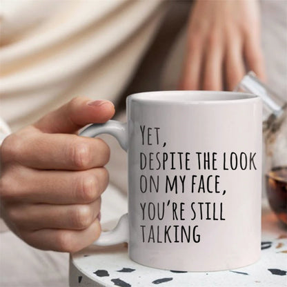 Funny Sarcasm Coffee Mug for Coworkers - Yet Despite The Look On My Face You're Still Talking Novelty White Ceramic 11 oz (325 ml)