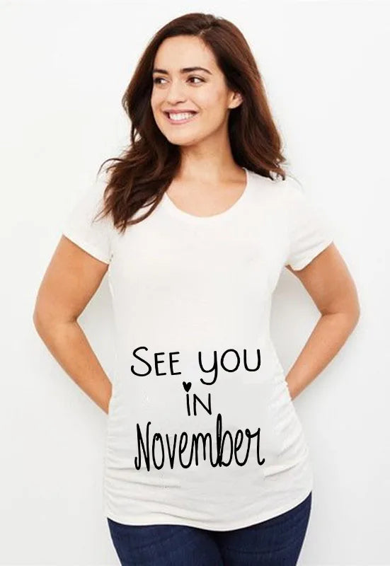 See You in May Print Pregnancy Announcement T-Shirt | Maternity Short Sleeve Tee | New Mom Shirts | Pregnancy Clothes Tops