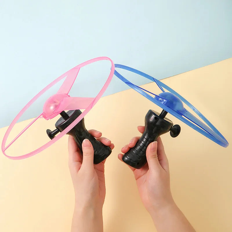 Luminous Pull-Line LED Flying Saucer Toy with Launcher — Light-Up Rotating Disk Flyer for Kids & Pets, Outdoor Fun