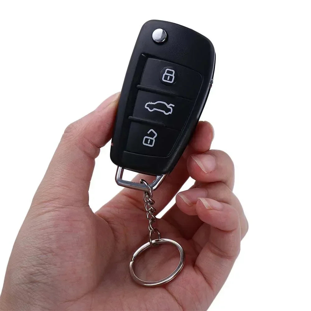 Black Electric Shock Car Key Prank Toy Keychain — Shock Gag Remote Key Ring (7 × 3.5 × 1.5 cm / 2.76 × 1.38 × 0.59 in)
